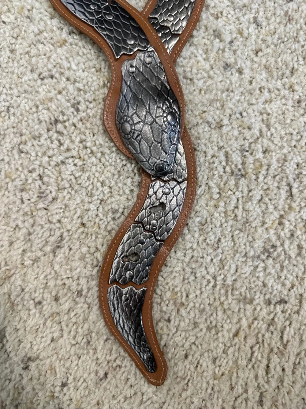 Vintage brown leather and silver colored metal articulated snake belt